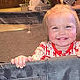 Raylynn is registered to the contest to win money with this photo: toddler, child, smiling, playpen, pajamas, indoor, happy, face, hands, hair, pony_tail, tooth, festive_clothing, baby, drool, grip, furniture, carpet, room, cute