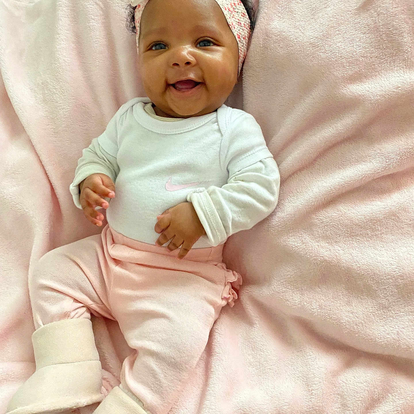 Ayaani joined the competition — help win amazing prizes! baby, babylaughing, blanket, face, happy, head, newborn, person, photography, portrait, quilt, smile