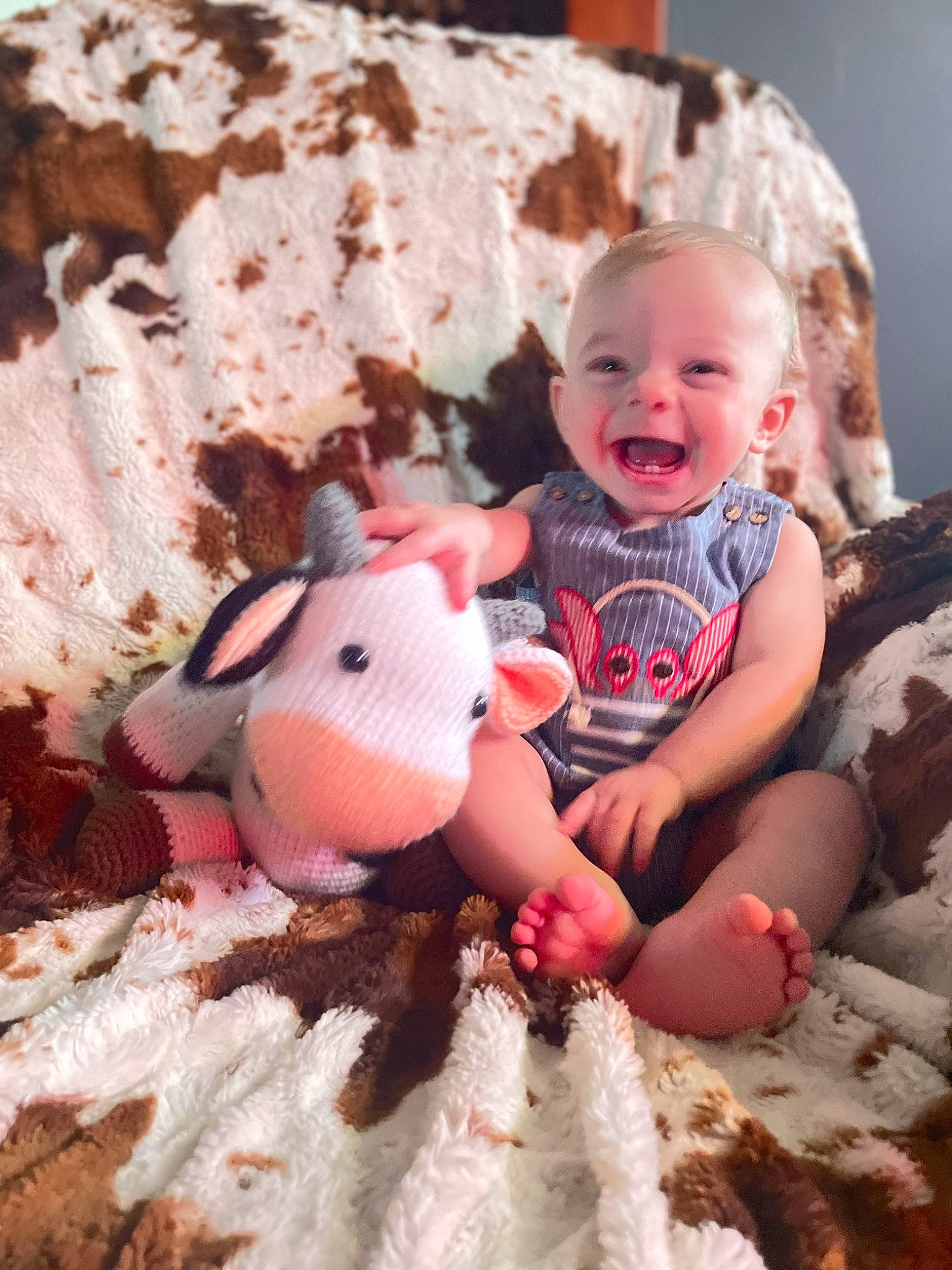 Fisher is registered to the contest to win money with this photo: baby, baby_toddler_clothing, child, foot, fun, grass, happy, leisure, mammal, people_in_nature, person, pink, sitting, skin, smile, stuffed_toy, t_shirt, teddy_bear, toddler, toy