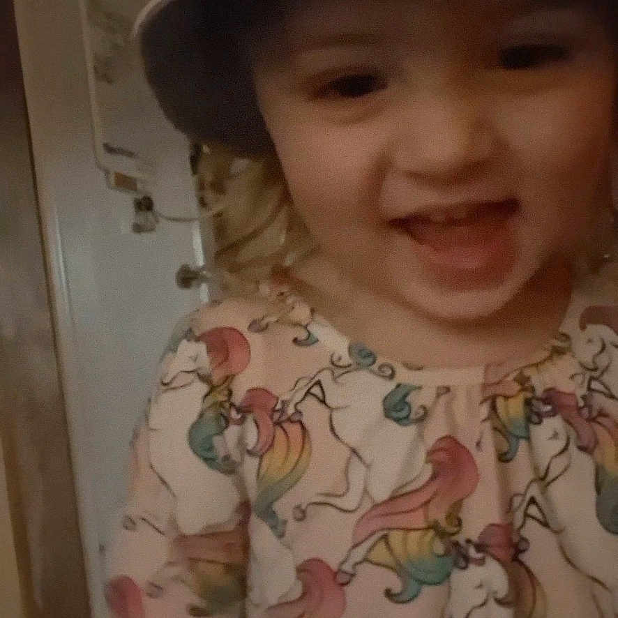 Lulabelle is registered to the contest to win money with this photo: baby, baseballcap, bodypart, bonnet, cap, clothing, door, dress, face, happy, hat, head, laughing, mouth, person, photography, portrait, smile, sunhat, teeth