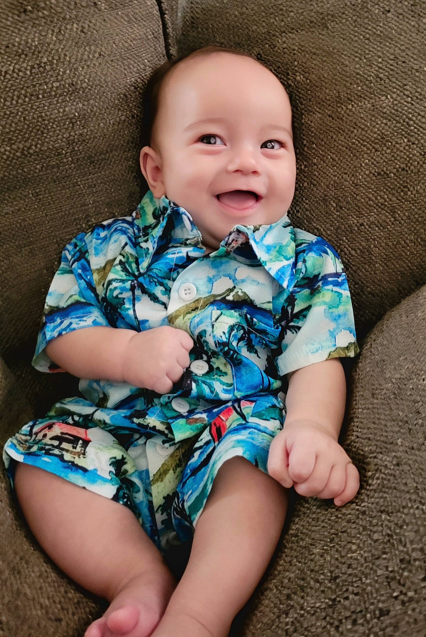 Kian is registered to the contest to win money with this photo: azure, baby_toddler_clothing, cheek, comfort, eye, facial_expression, finger, flash_photography, happy, human_body, iris, joy, leg, neck, organ, person, skin, sleeve, smile, standing