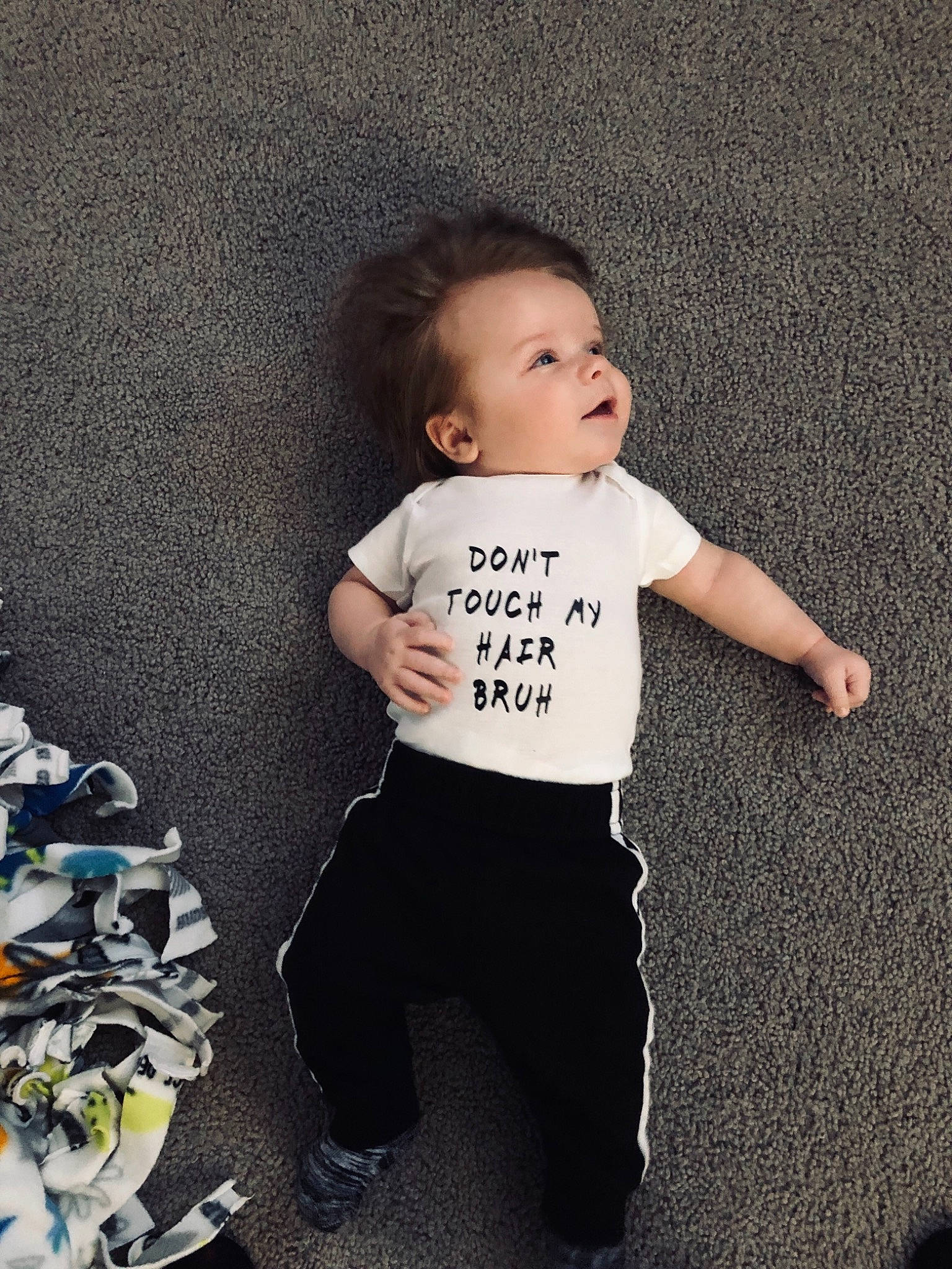 Alden is registered to the contest to win money with this photo: boy, child, cool, day, fun, girl, human, infant, joint, outerwear, person, product, shoulder, sleeve, smile, standing, t_shirt, toddler