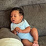 Kyndyl joined the competition — help win amazing prizes! baby, child, infant, couch, sofa, blanket, clothing, onesie, relaxing, indoor, furniture, skin, face, hand, foot, curly_hair, person, seated, young, casual