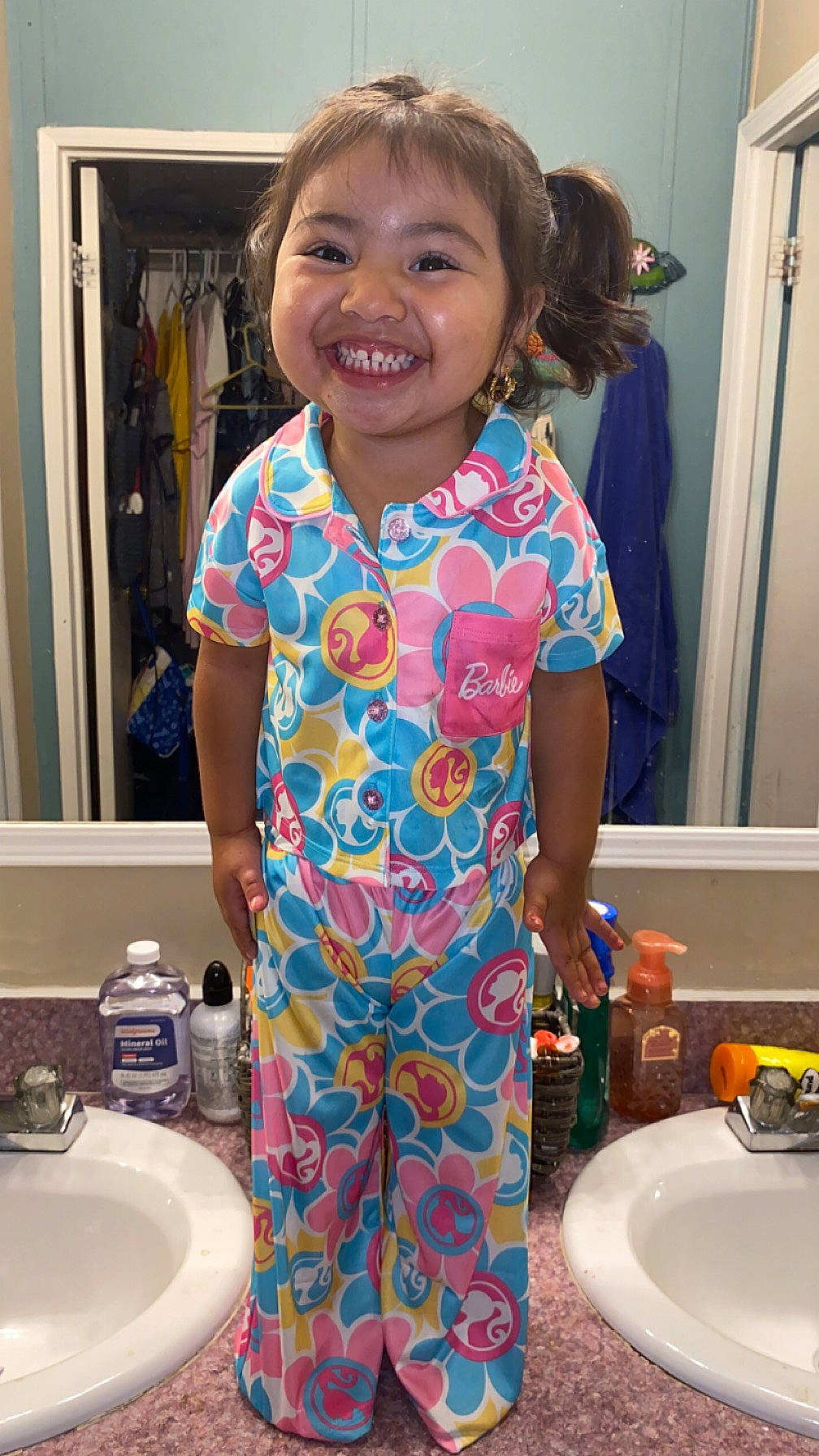 Vivianna is registered to the contest to win money with this photo: arm, bathroom_sink, blue, chair, child, cooking, door, fun, hair, happy, joy, paint, person, plate, plumbing_fixture, purple, sink, sleeve, smile, t_shirt