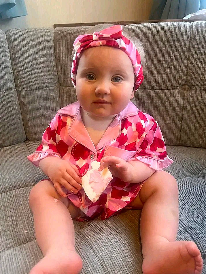 Phoebe joined the competition — help win amazing prizes! baby_toddler_clothing, cheek, comfort, couch, eyewear, fashion_accessory, goggles, happy, head, headwear, human_leg, lip, magenta, neck, pattern, person, pink, sleeve, sunglasses, thigh