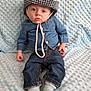 baby, denim, hat, blue_blanket, infant, clothing, jeans, socks, portrait, cute, child, soft_texture, indoor, casual, fabric, small_hands, seated, headwear, expression, young