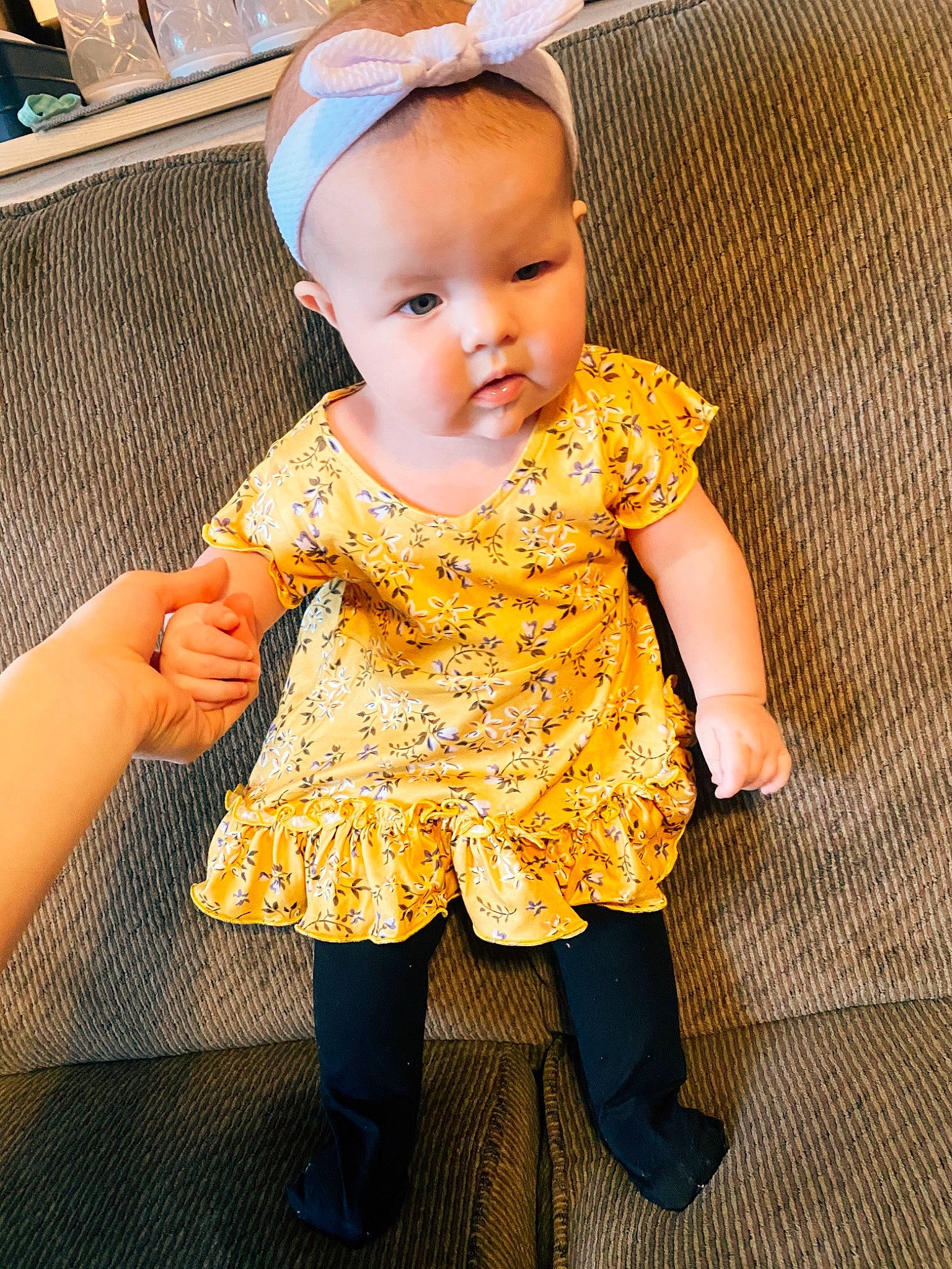 Aspyn is registered to the contest to win money with this photo: arm, baby, baby_toddler_clothing, child, day_dress, dress, eye, hand, happy, hat, head, headband, human_leg, iris, pattern, person, skin, sleeve, textile, thigh