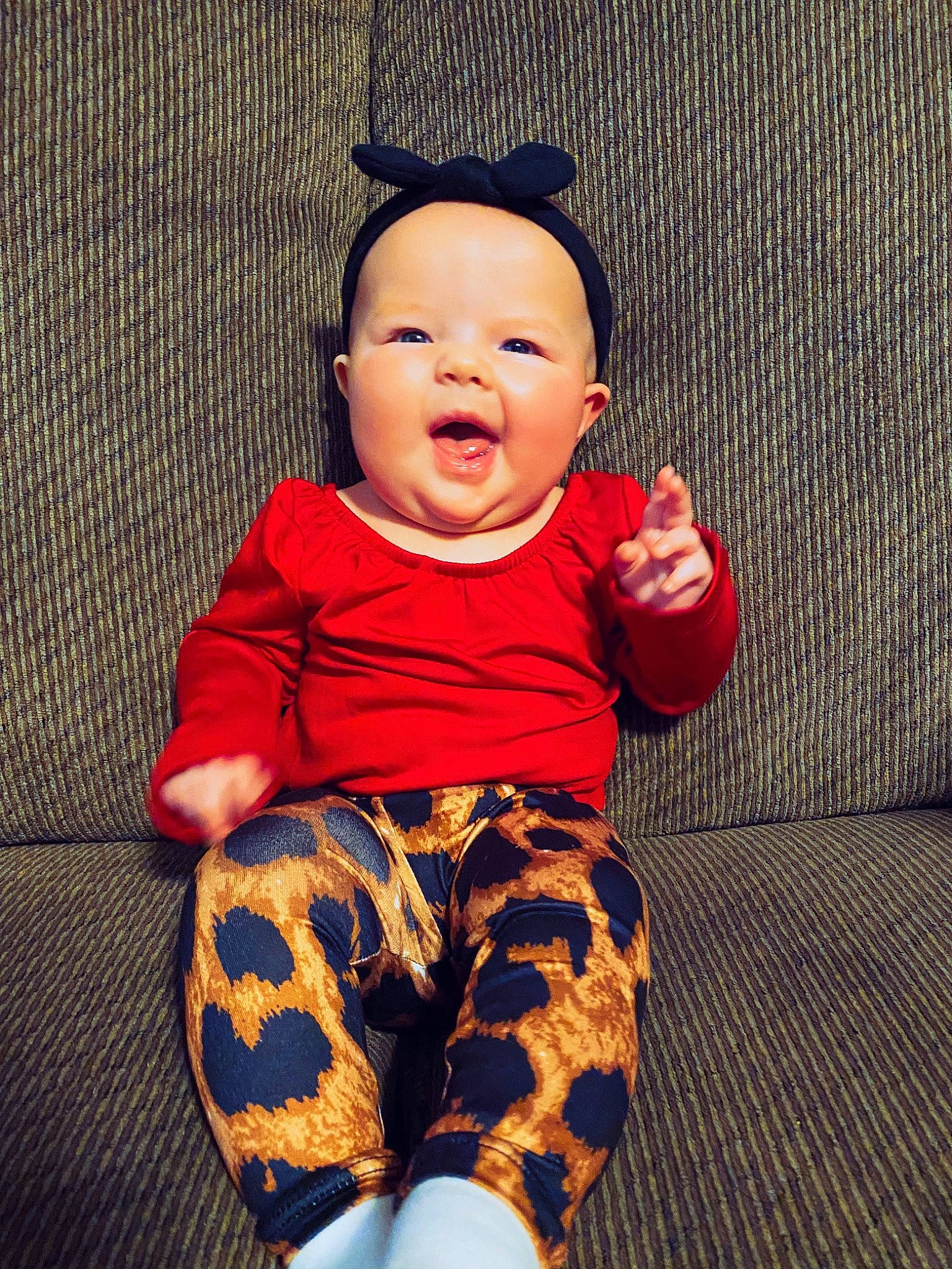 Aspyn is registered to the contest to win money with this photo: arm, baby, baby_toddler_clothing, cheek, comfort, eye, face, hand, happy, head, human_body, leg, orange, pattern, person, skin, sleeve, t_shirt, textile, toddler