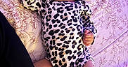 Naomi joined the competition — help win amazing prizes! baby, bedspread, child, cute, face, floral_pattern, hand, human, indoors, infant, leg, leopard_print, newborn, onesie, peaceful, purple_light, resting, skin, sleeping, soft_lighting