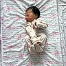newborn, baby, sleeping, infant, blanket, onesie, pink, white, pattern, ribbons, hearts, cute, cozy, soft, peaceful, portrait, child, indoor, resting, small