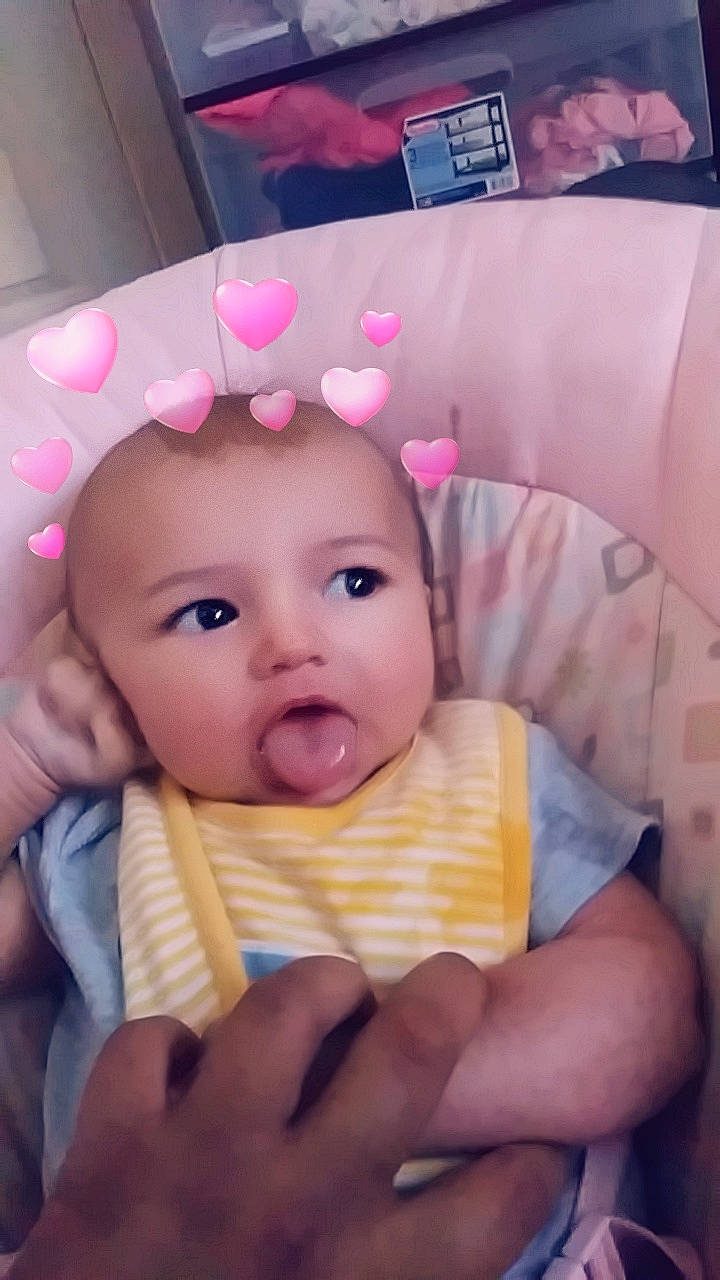 Dawn is registered to the contest to win money with this photo: cheek, child, day, ear, eye, eyebrow, face, finger, forehead, hand, head, infant, iris, lip, mouth, nose, person, pink, product, skin