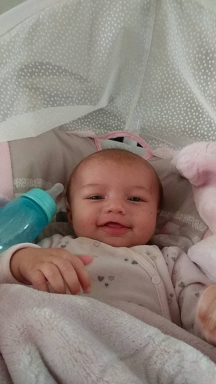 Dawn is registered to the contest to win money with this photo: baby_products, bed, bedtime, cheek, child, childbirth, finger, girl, hand, infant, infant_bed, lip, mouth, nose, person, product, skin, toddler