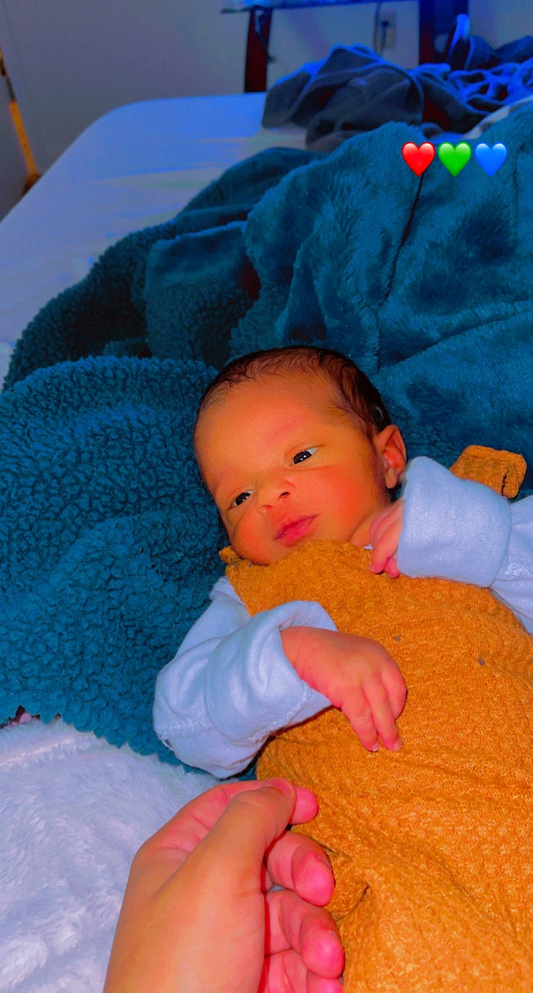 Arlo is registered to the contest to win money with this photo: abdomen, baby, baby_products, baby_sleeping, baby_toddler_clothing, bedtime, cheek, child, comfort, electric_blue, finger, iris, lap, linens, nose, person, red, skin, textile, thumb