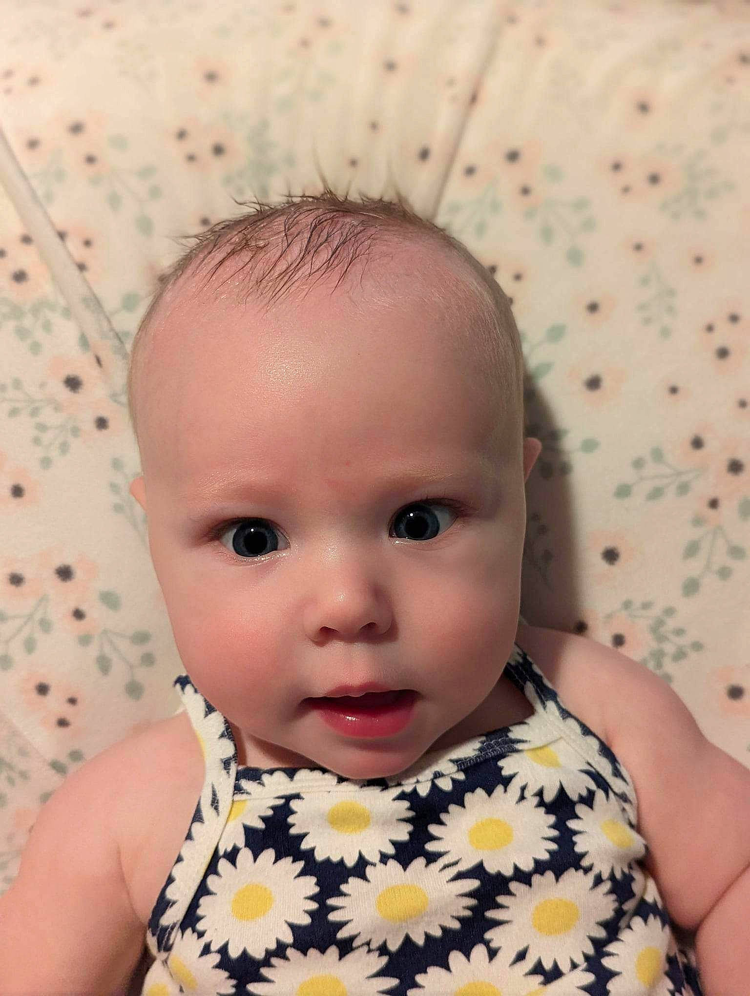 Elizabeth is registered to the contest to win money with this photo: baby, baby_toddler_clothing, cheek, child, collar, day_dress, dress, eyelash, happy, iris, linens, lip, neck, nose, pattern, person, portrait_photography, skin, sleeve, textile