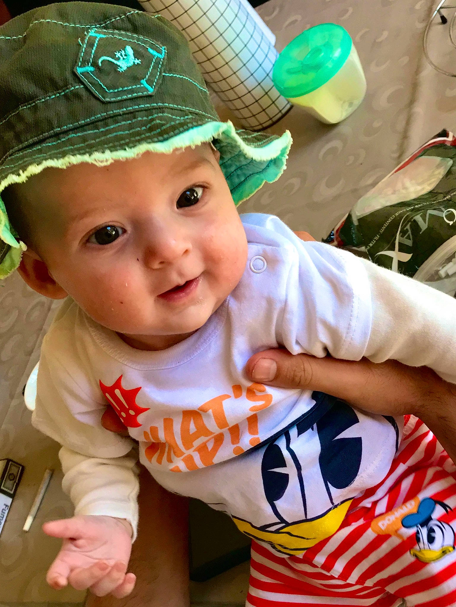 Aaron participe au concours pour gagner de l'argent avec cette photo : baby, baby_toddler_clothing, child, fashion_accessory, hat, headgear, headwear, person, sun_hat, toddler