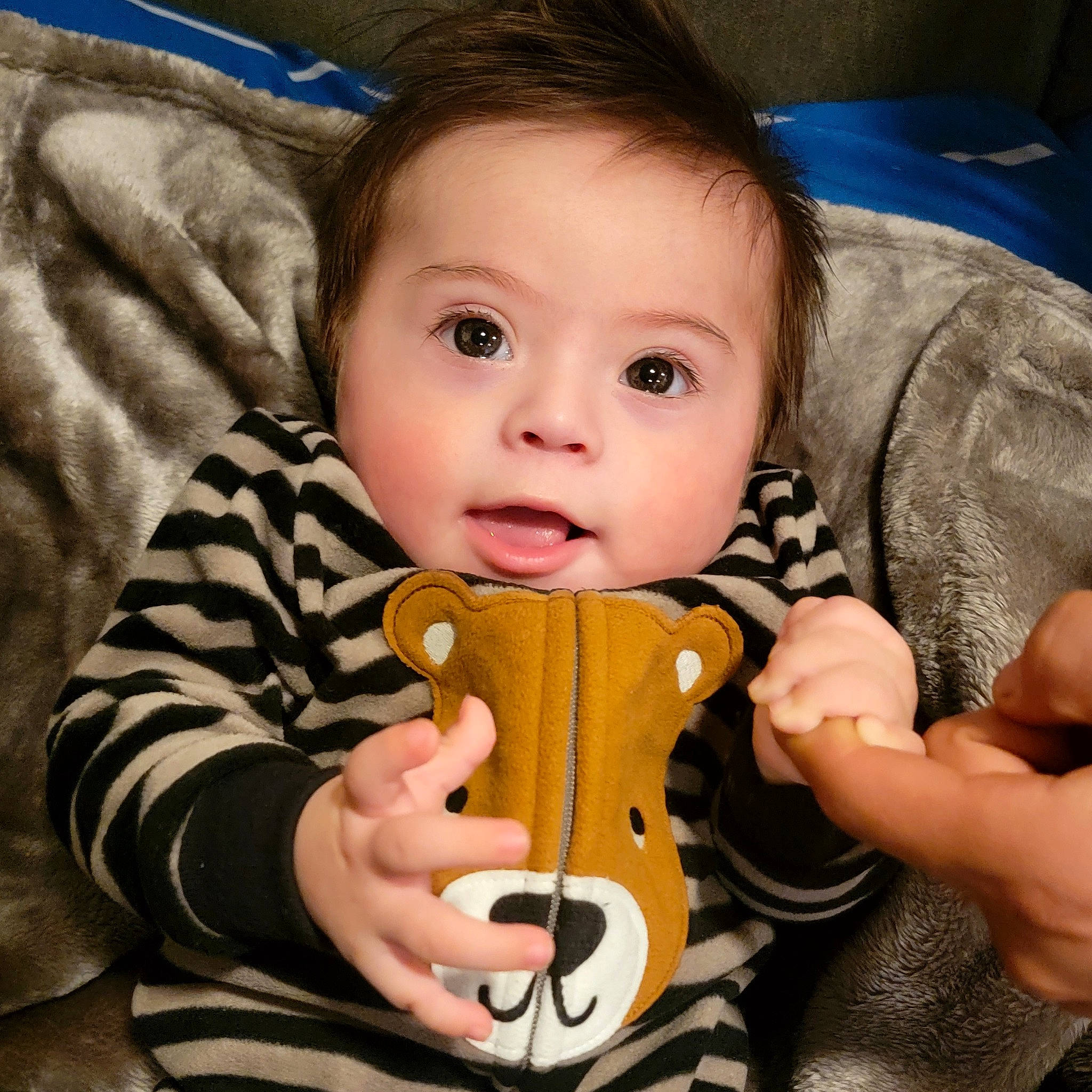 Derrick joined the competition — help win amazing prizes! baby, baby_products, baby_toddler_clothing, blue, cheek, comfort, eye, face, finger, fun, gesture, hand, happy, head, nose, person, skin, sleeve, textile, thumb