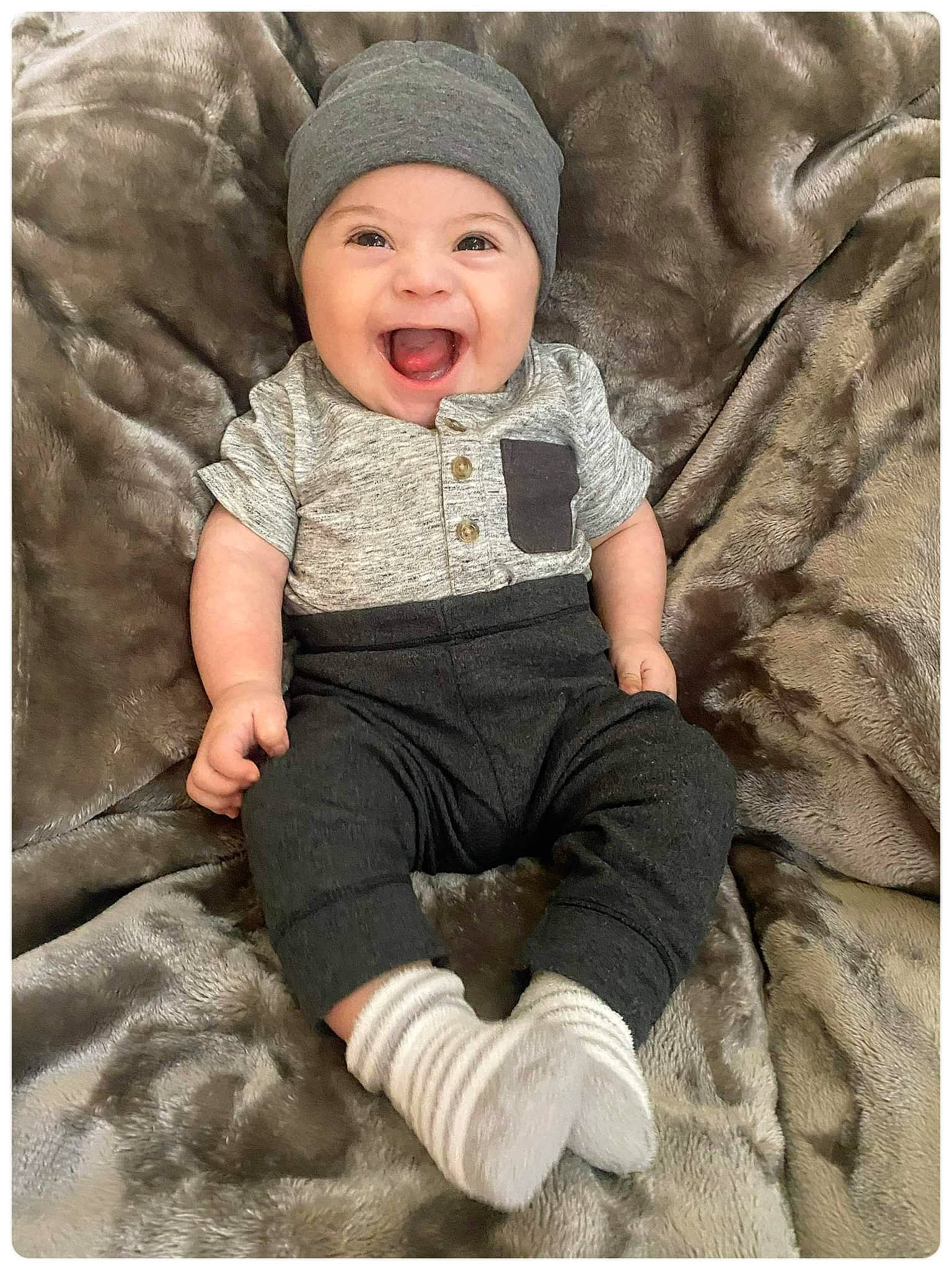 Derrick is registered to the contest to win money with this photo: baby, baby_toddler_clothing, beauty, child, collar, comfort, eye, flash_photography, happy, headwear, linens, outerwear, pattern, person, photograph, rectangle, sitting, sleeve, smile, stock_photography