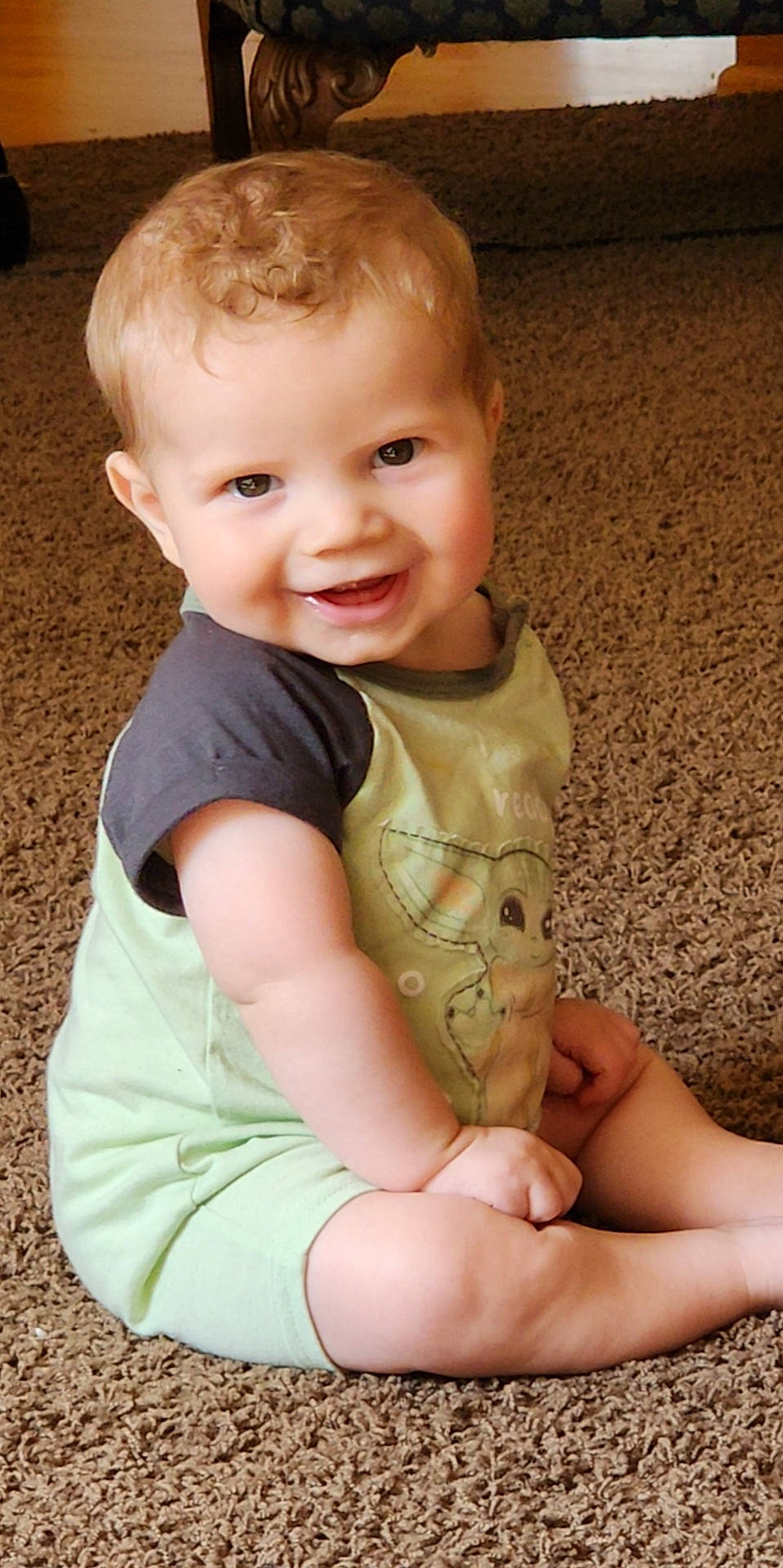 Echo is registered to the contest to win money with this photo: baby, baby_toddler_clothing, cheek, child, chin, eye, face, finger, flooring, grass, hand, happy, head, human_body, joy, nose, organ, person, skin, sleeve