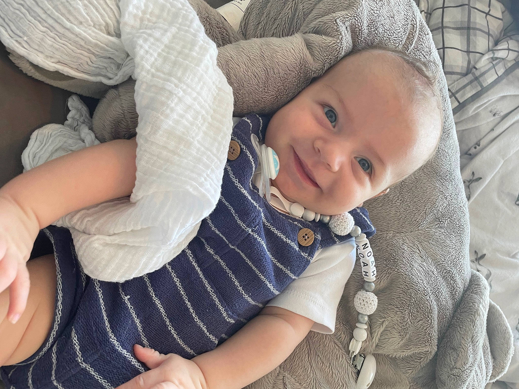 Noah joined the competition — help win amazing prizes! baby, baby_toddler_clothing, cheek, child, comfort, elbow, finger, gesture, hand, happy, head, human_body, joy, pattern, person, sitting, skin, sleeve, smile, textile