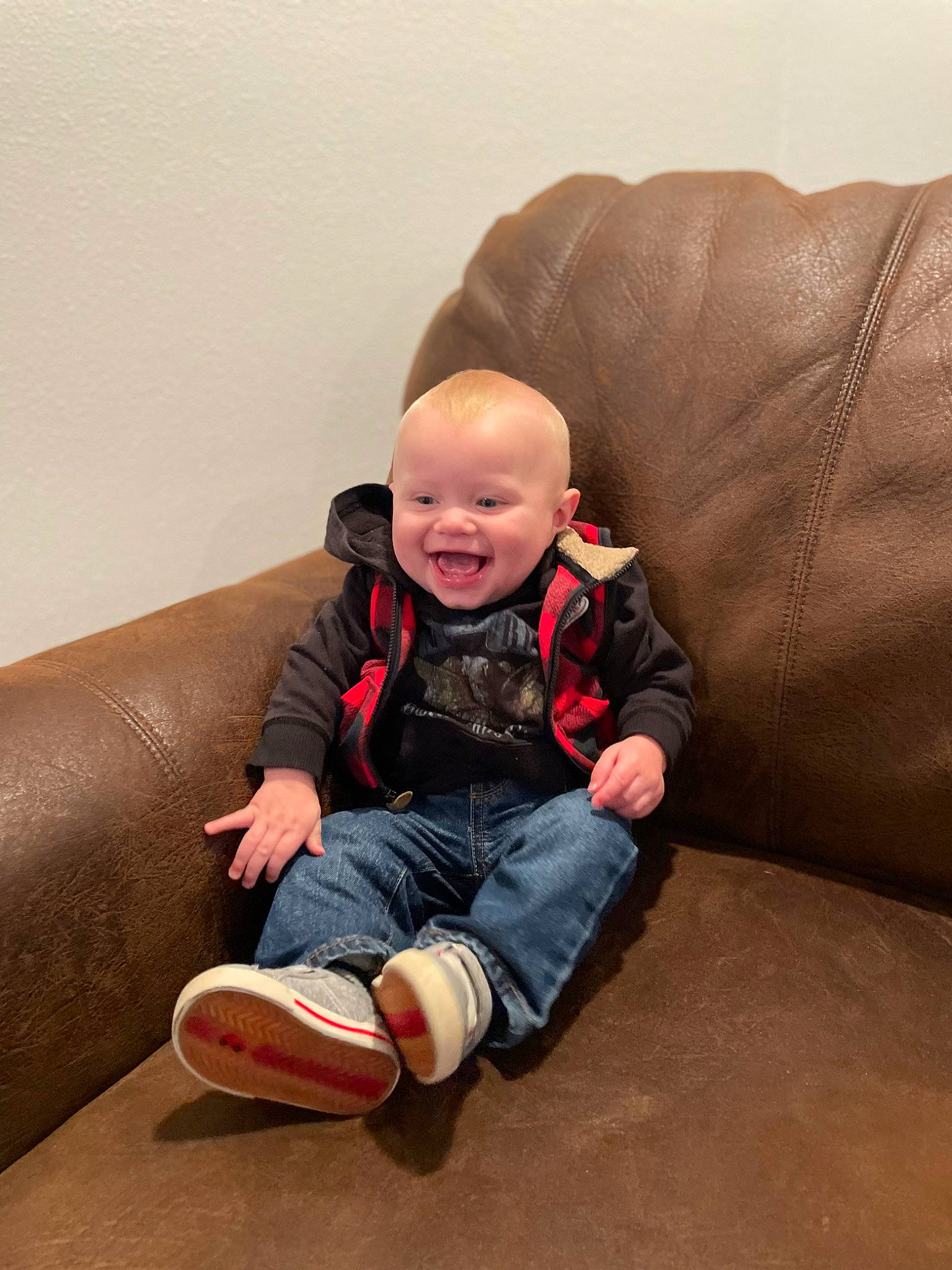 Hudson joined the competition — help win amazing prizes! baby, baby_toddler_clothing, cheek, comfort, couch, eye, face, flooring, happy, hardwood, head, human_leg, joy, knee, leg, person, sitting, sleeve, smile, sock