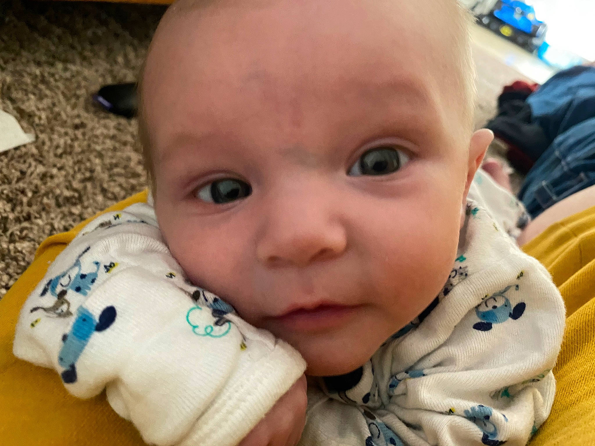 Timmy is registered to the contest to win money with this photo: baby, baby_toddler_clothing, blue, cheek, child, ear, eyelash, finger, fun, gesture, happy, iris, lip, mouth, nail, nose, person, skin, smile, thumb