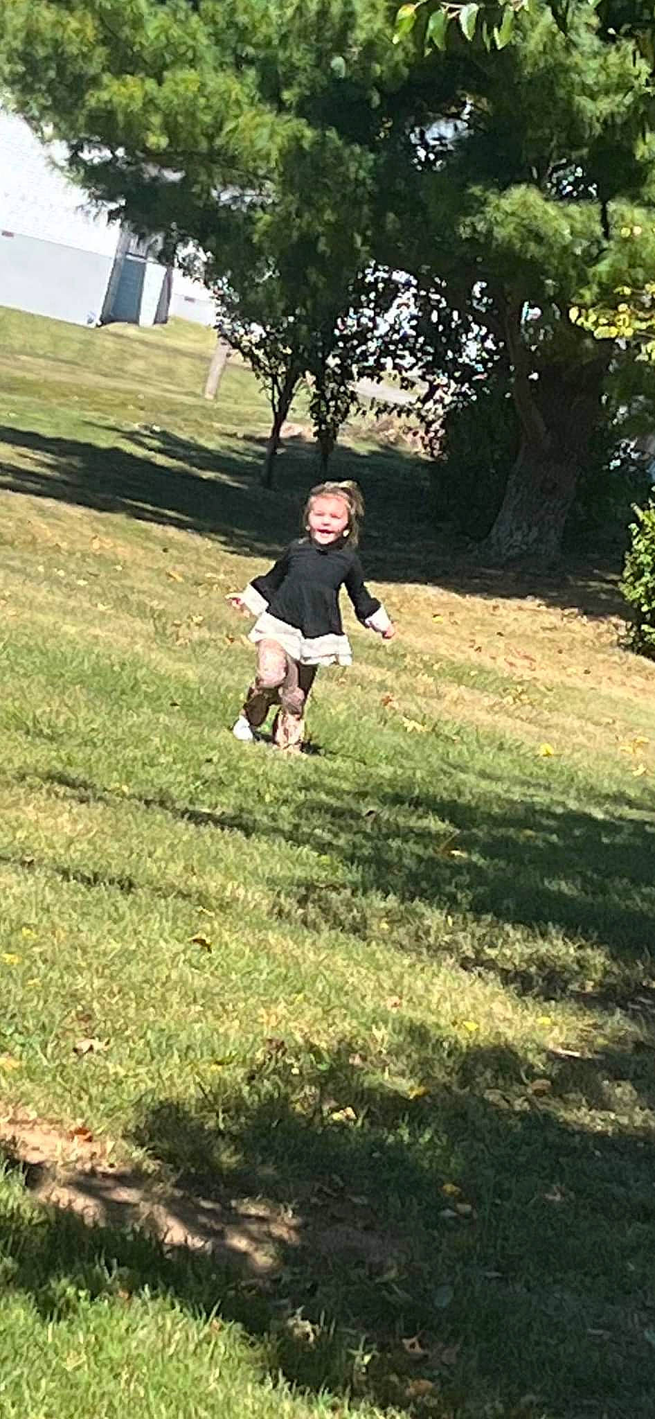 Oaklyn is registered to the contest to win money with this photo: child, fun, grass, grass_family, grassland, groundcover, happy, landscape, lawn, leisure, meadow, pasture, people_in_nature, person, plant, recreation, sitting, soil, tints_and_shades, tree