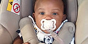 Demari joined the competition — help win amazing prizes! baby, beige, car_seat, child, clothing, comfort, cute, face, hand, head, indoor, infant, pacifier, play, safety, seat_belt, sitting, straps, toy, young_child