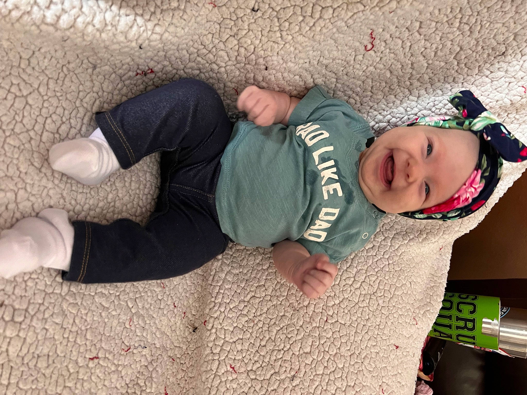 Annie is registered to the contest to win money with this photo: baby, baby_toddler_clothing, child, comfort, flooring, fun, grass, hand, happy, headwear, human_leg, joint, knee, leg, person, sitting, sleeve, smile, sock, toddler