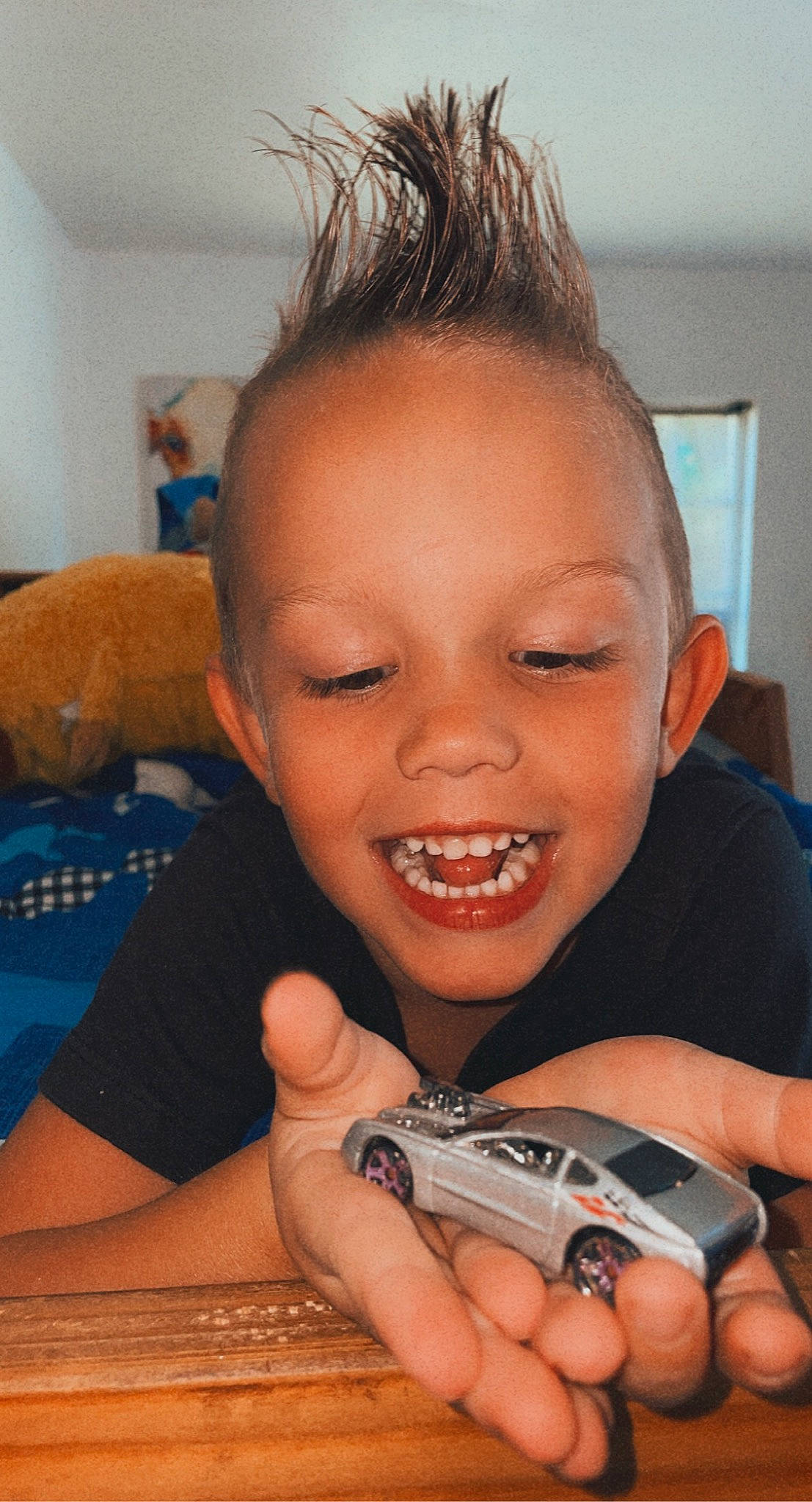 Oliver is registered to the contest to win money with this photo: cheek, child, ear, eyebrow, eyelash, finger, fun, gadget, hand, happy, iris, joy, mouth, nail, nose, person, skin, smile, thumb, toddler