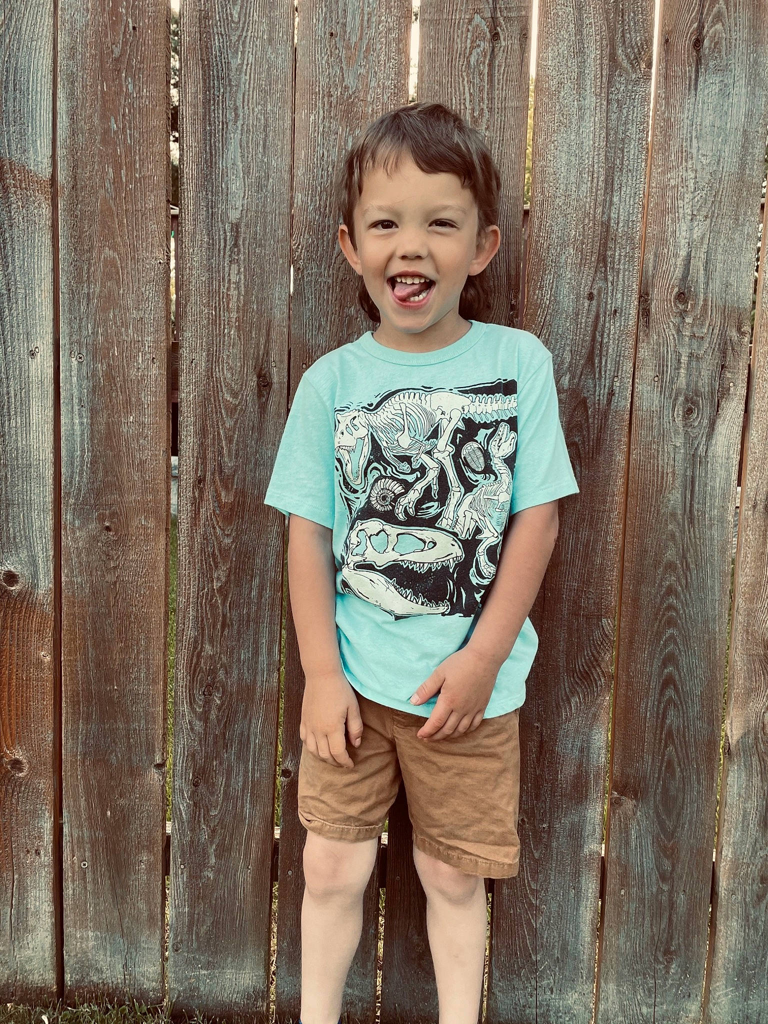 Oliver is registered to the contest to win money with this photo: baby_toddler_clothing, child, chin, clothing, cool, eye, flash_photography, hair, happy, joy, people_in_nature, person, shorts, skin, sleeve, smile, standing, street_fashion, t_shirt, tree