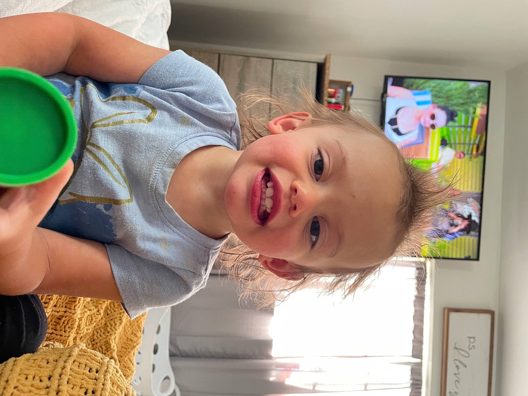 Macie is registered to the contest to win money with this photo: baby, baby_laughing, baby_products, baby_toddler_clothing, cheek, child, fun, happy, joy, leisure, mouth, nose, person, play, product, room, skin, smile, standing, t_shirt