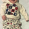 Isaac joined the competition — help win amazing prizes! baby, boy, smiling, beanie, hoodie, pants, patterned_clothing, star_pattern, blanket, lying_down, happy, infant, cute, warm_clothing, indoor, soft_texture, child, portrait, casual, comfortable