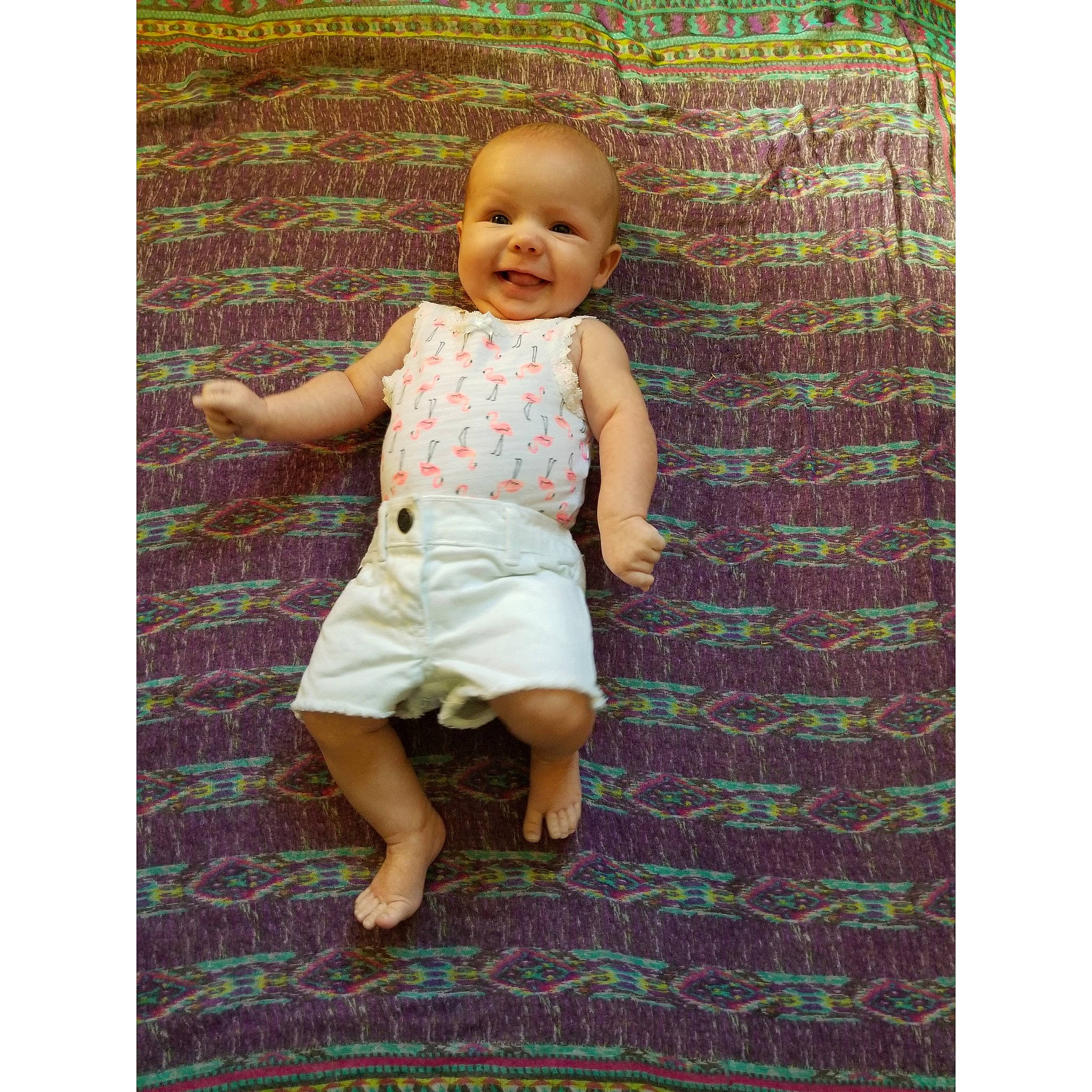 Ellayna is registered to the contest to win money with this photo: baby, blond, brown, child, design, dress, fawn, green, joy, pattern, person, photograph, pink, product, purple, sitting, smile, toddler, turquoise