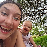 Avery joined the competition — help win amazing prizes! woman, toddler, child, smiling, outdoor, tree, grass, nature, happy, portrait, playful, greenery, sunlight, casual, fun, person, summer, dress, selfie, family