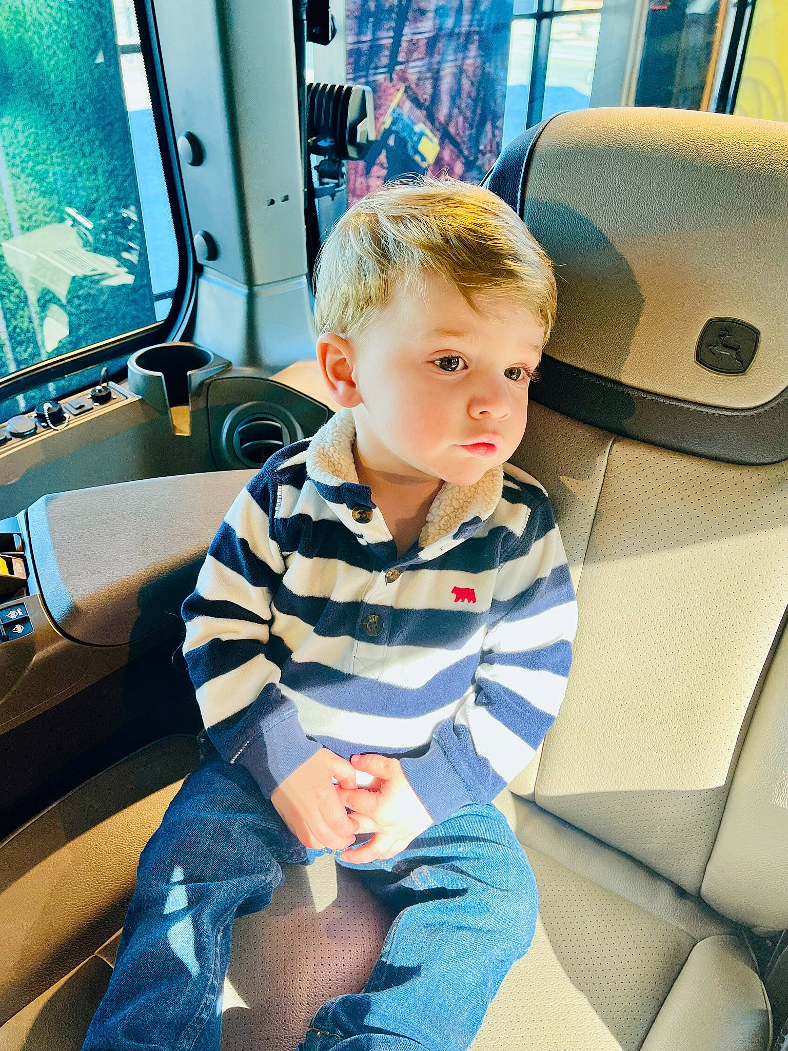 Jasper joined the competition — help win amazing prizes! auto_part, automotive_design, car_seat, car_seat_cover, child, comfort, cool, electric_blue, fun, hairstyle, human, lap, leisure, motor_vehicle, person, product, standing, t_shirt, technology, toddler