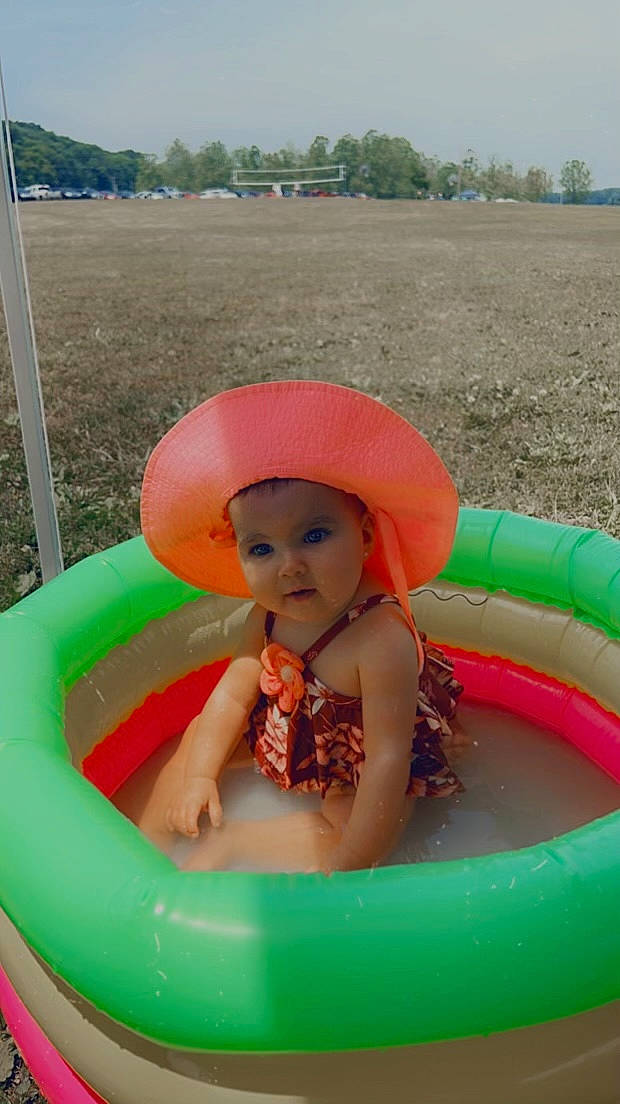 Mazikeen is registered to the contest to win money with this photo: baby_toddler_clothing, child, fun, grass, green, happy, hat, headwear, leisure, organ, person, photograph, pink, plant, product, recreation, red, sky, summer, toddler