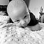baby, bed, bedroom, blanket, bodypart, crawling, face, finger, furniture, hand, happy, head, indoors, newborn, person, photography, portrait, quilt, room, smile