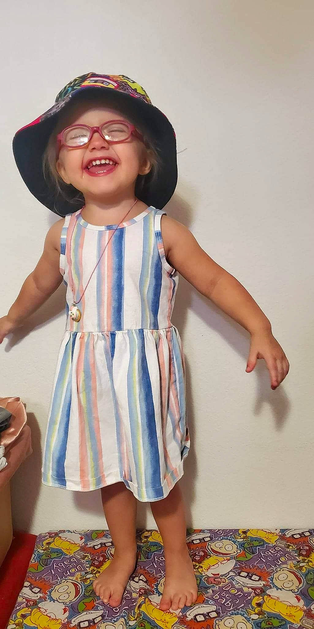 Lillian is registered to the contest to win money with this photo: clothing, day_dress, dress, face, facial_expression, fashion, gesture, glasses, hairstyle, happy, hat, joint, joy, neck, one_piece_garment, person, shoulder, skin, sleeve, smile