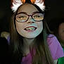 child, girl, glasses, long_hair, smile, teeth, digital_ears, fox_ears, purple_shirt, dark_background, face, portrait, happy, young, person, indoors, closeup, head_and_shoulders, casual, fun