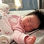 Arely is registered to the contest to win money with this photo: baby, sleeping, infant, blanket, bed, pajamas, hair, peaceful, cozy, indoors, face, child, resting, soft_light, comfort, cute, toddler, skin, person, sleep