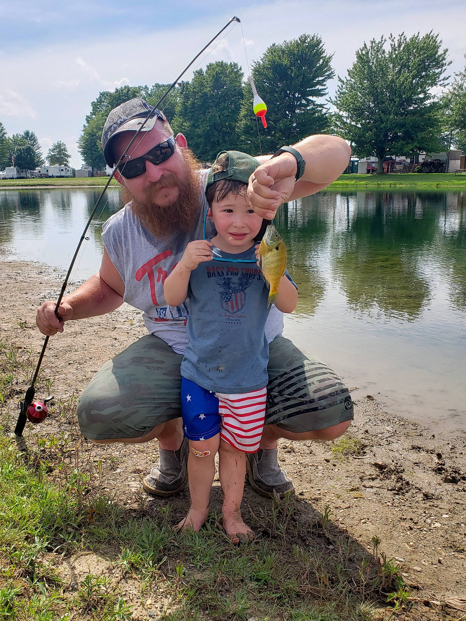 Case is registered to the contest to win money with this photo: angling, bank, child, fish, fishing, fishing_rod, fun, headwear, joy, person, play, recreation, recreational_fishing, river, smile, summer, toddler, tree, vacation