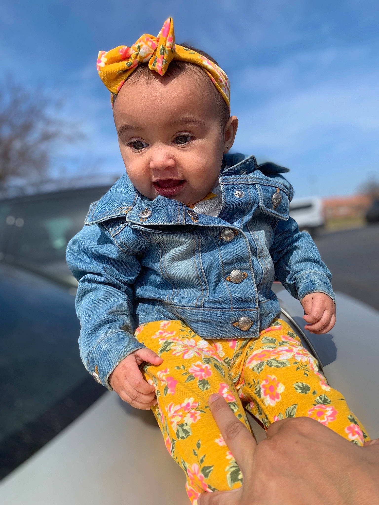 Ameena is registered to the contest to win money with this photo: baby, baby_toddler_clothing, child, chin, cool, denim, electric_blue, eye, fun, grass, hairstyle, happy, human_body, leisure, pattern, person, skin, sky, sleeve, t_shirt