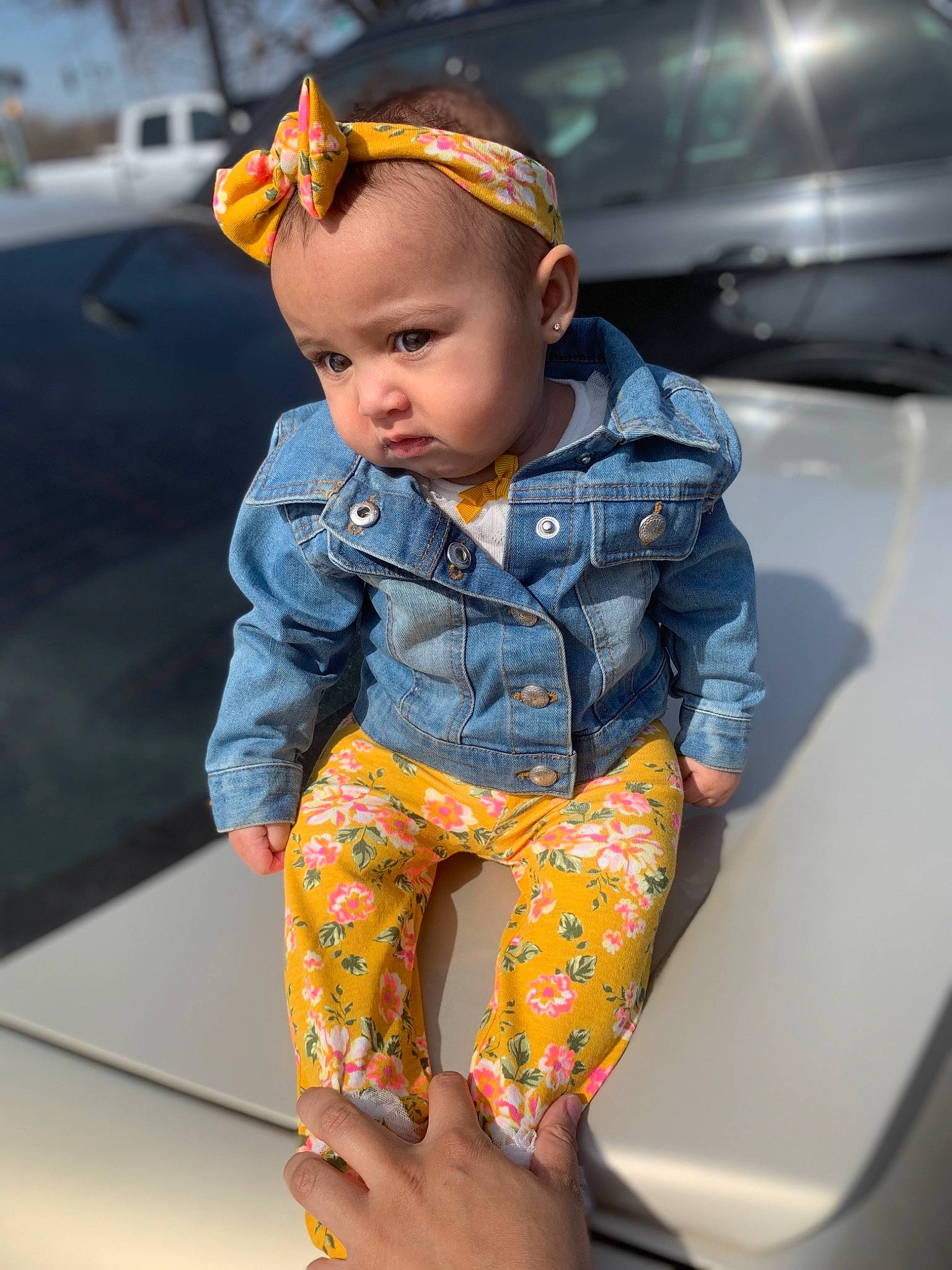 Ameena is registered to the contest to win money with this photo: baby_toddler_clothing, child, denim, electric_blue, face, fashion_design, fun, hand, head, human_body, human_leg, iris, jeans, person, personal_protective_equipment, sitting, sleeve, street_fashion, t_shirt, thigh