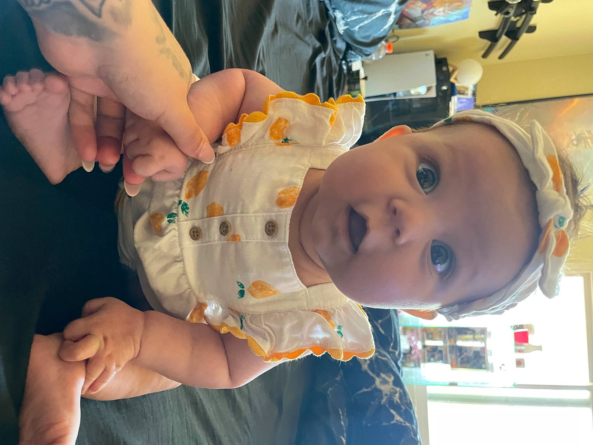 Anastasia is registered to the contest to win money with this photo: baby, baby_products, baby_toddler_clothing, cheek, child, dress, ear, finger, fun, gesture, hand, happy, mouth, nail, nose, person, room, skin, surprise, thumb