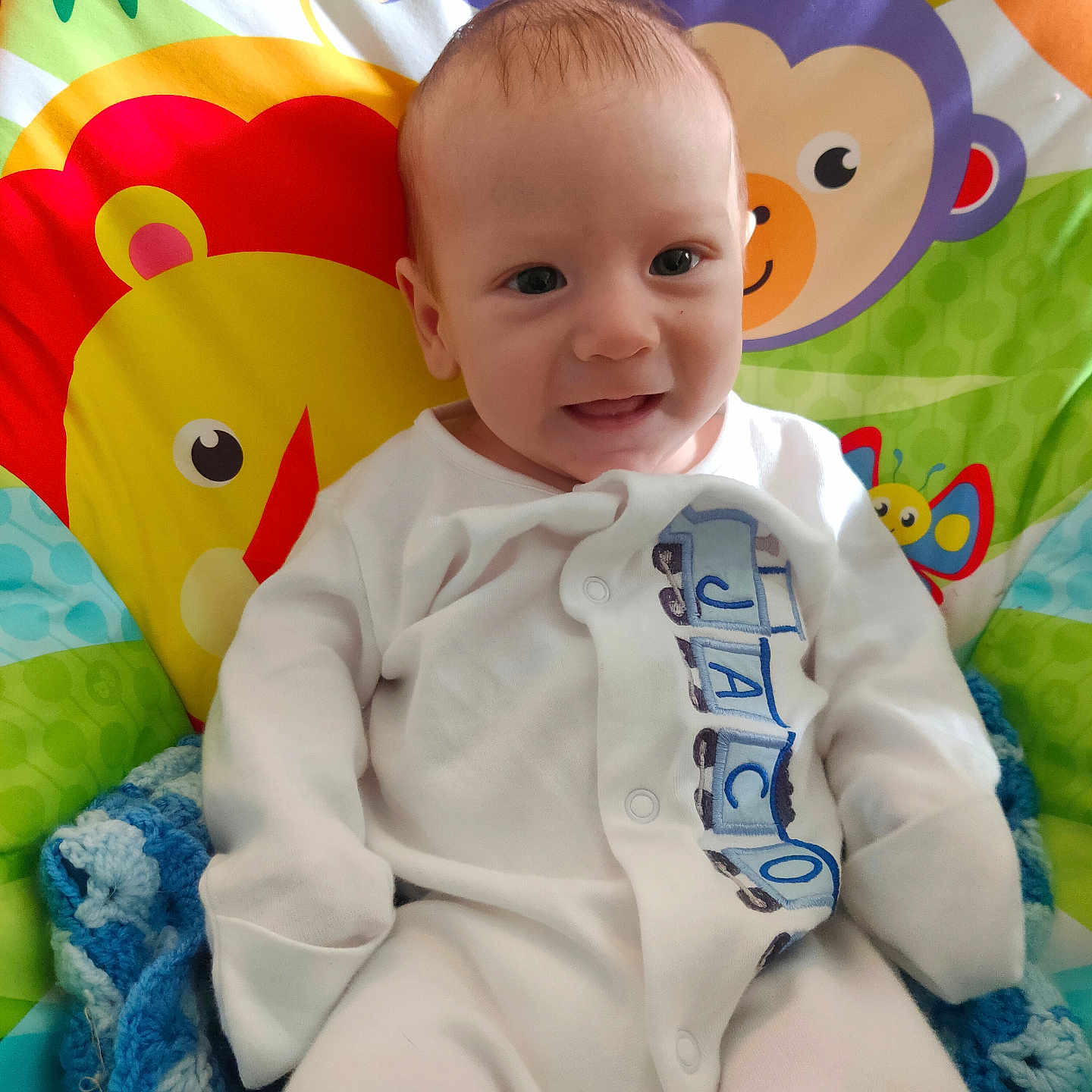 Jacob joined the competition — help win amazing prizes! baby, blanket, clothing, coat, cushion, face, furniture, happy, head, homedecor, jacket, newborn, pants, person, photography, portrait, quilt, shirt, sitting, smile