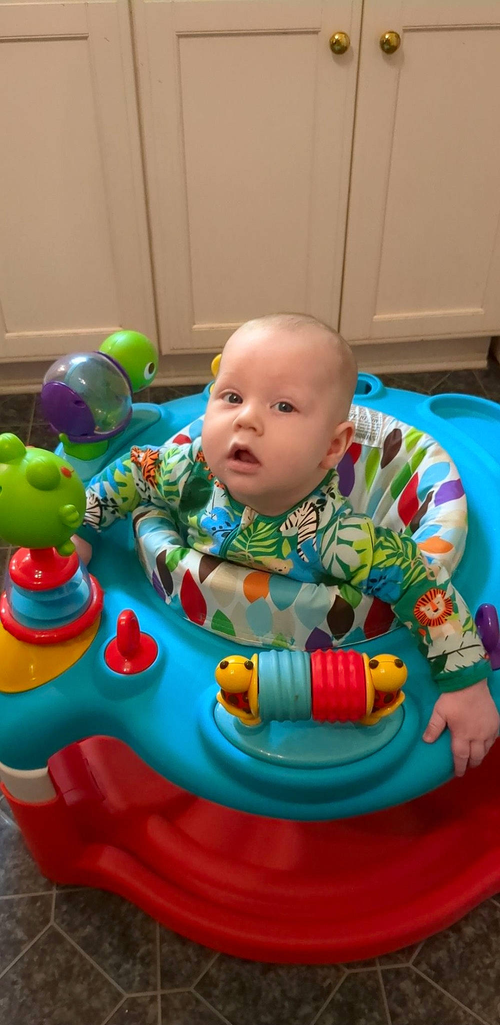 Dean joined the competition — help win amazing prizes! baby, baby_playing_with_toys, baby_products, baby_toddler_clothing, baby_toys, child, comfort, event, flooring, fun, leisure, person, plastic, play, product, recreation, room, sitting, surprise, toddler