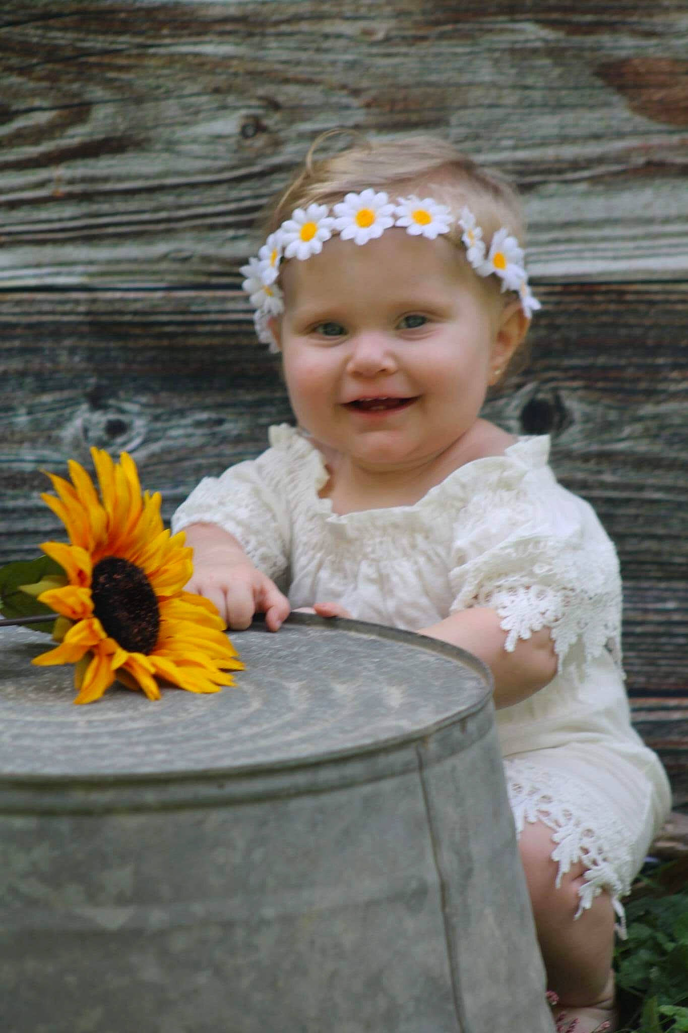 Bristol joined the competition — help win amazing prizes! baby, child, fashion_accessory, flower, hair_accessory, headband, headgear, headpiece, headwear, joy, person, plant, sunflower, toddler, yellow