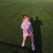 Ava is registered to the contest to win money with this photo: casual_clothing, child, daylight, field, girl, grass, hello_kitty, injury, knee, outdoor, people, person, photography, playing_field, shadow, shorts, sneakers, sports, sunlight, tshirt
