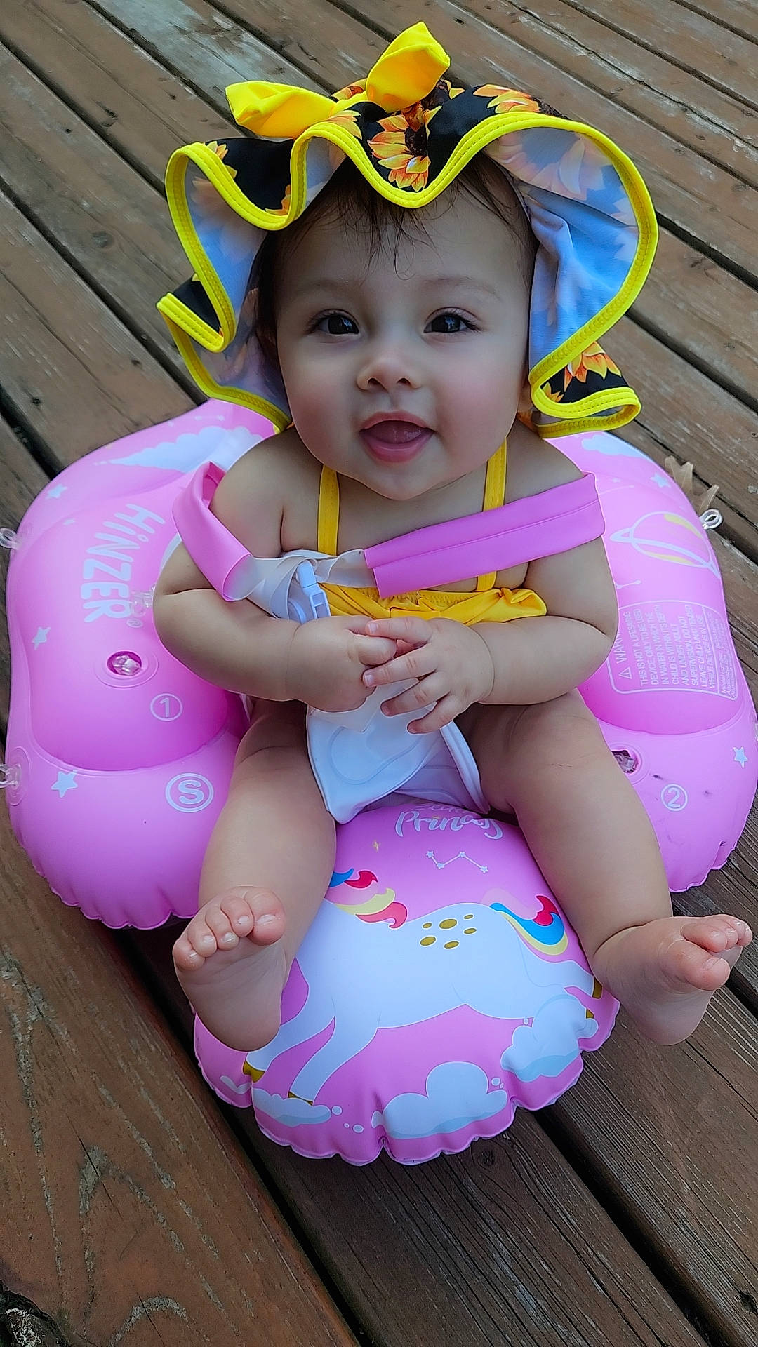 Bella Rose is registered to the contest to win money with this photo: baby, baby_toddler_clothing, bib, child, face, fashion_accessory, fun, goggles, grass, happy, head, headwear, magenta, people_in_nature, person, pink, purple, recreation, sitting, toddler