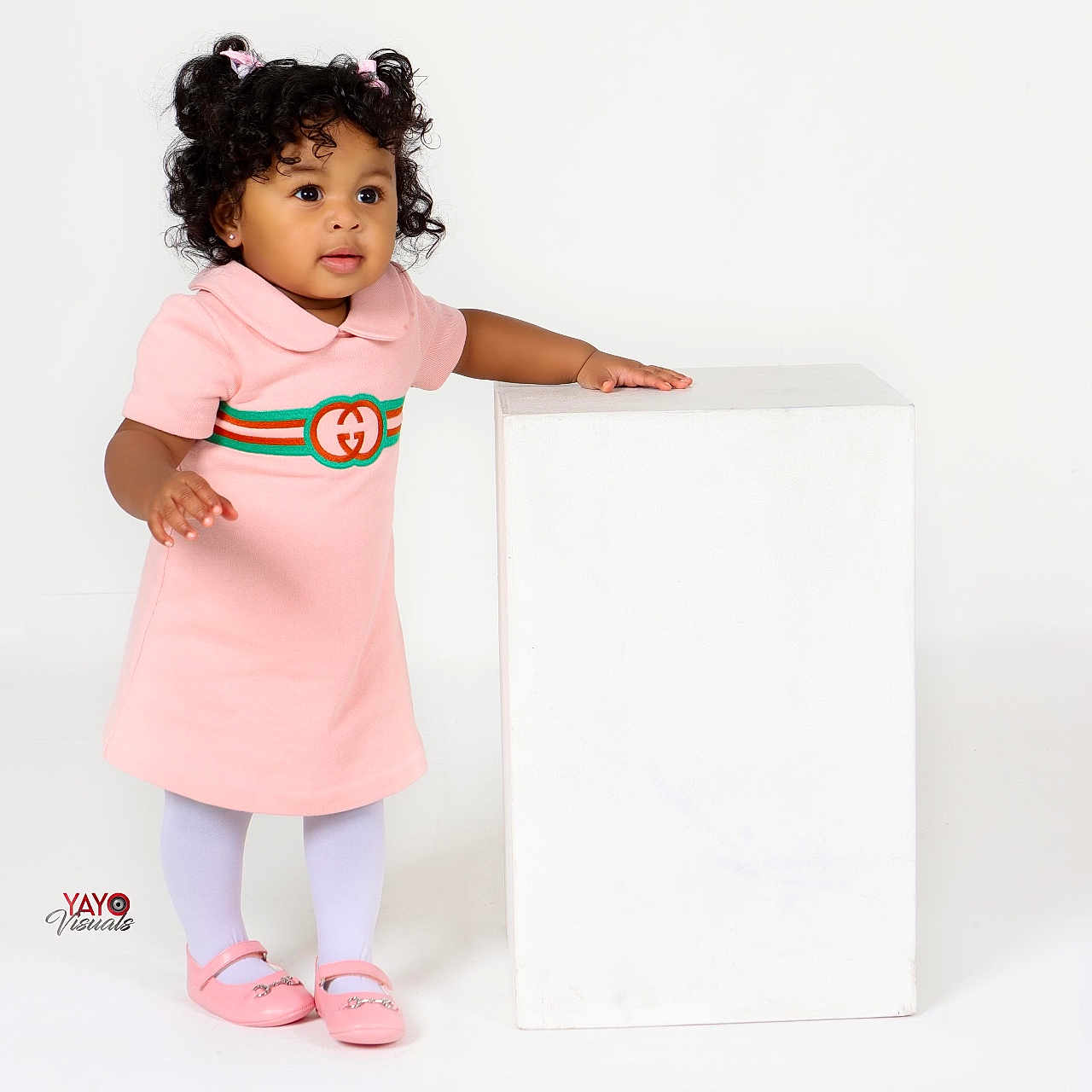 Adrian is registered to the contest to win money with this photo: bodypart, child, clothing, dress, face, female, finger, footwear, formalwear, girl, hand, head, longsleeve, person, photography, portrait, shoe, sleeve, standing, t_shirt